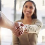 Woman shaking hands with other person