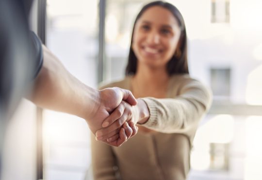 Woman shaking hands with other person