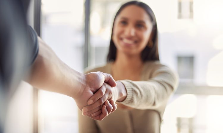 Woman shaking hands with other person