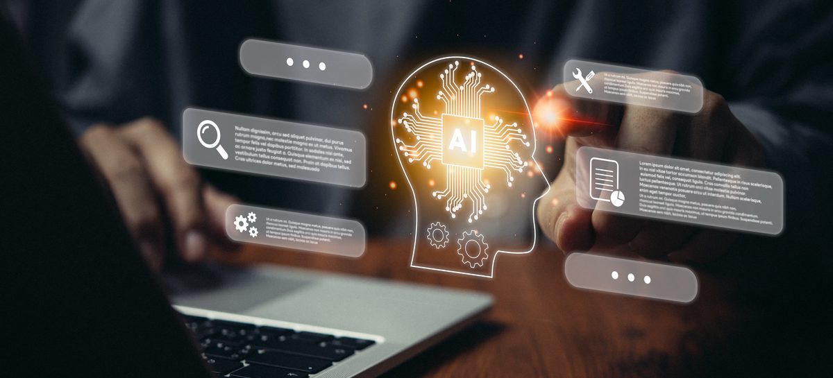 Person typing on keyboard with icons representing technology and AI hovering on top