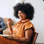 Woman smiling during meeting in office