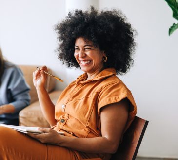 Woman smiling during meeting in office