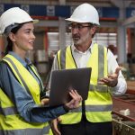 Engineers talking in manufacturing facility