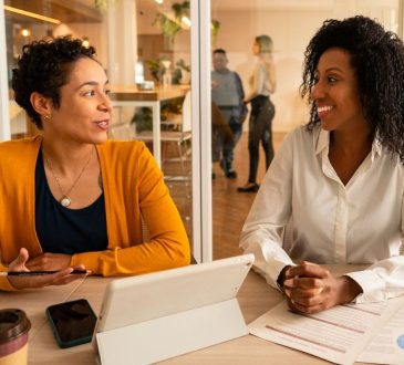Two people meeting in office