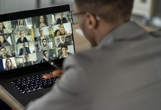 Person on video call on laptop