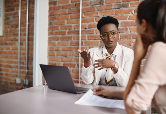 Two women meeting in office