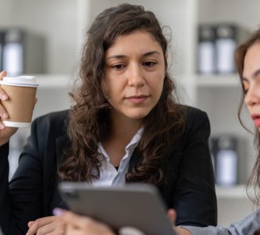 Two women talking in office