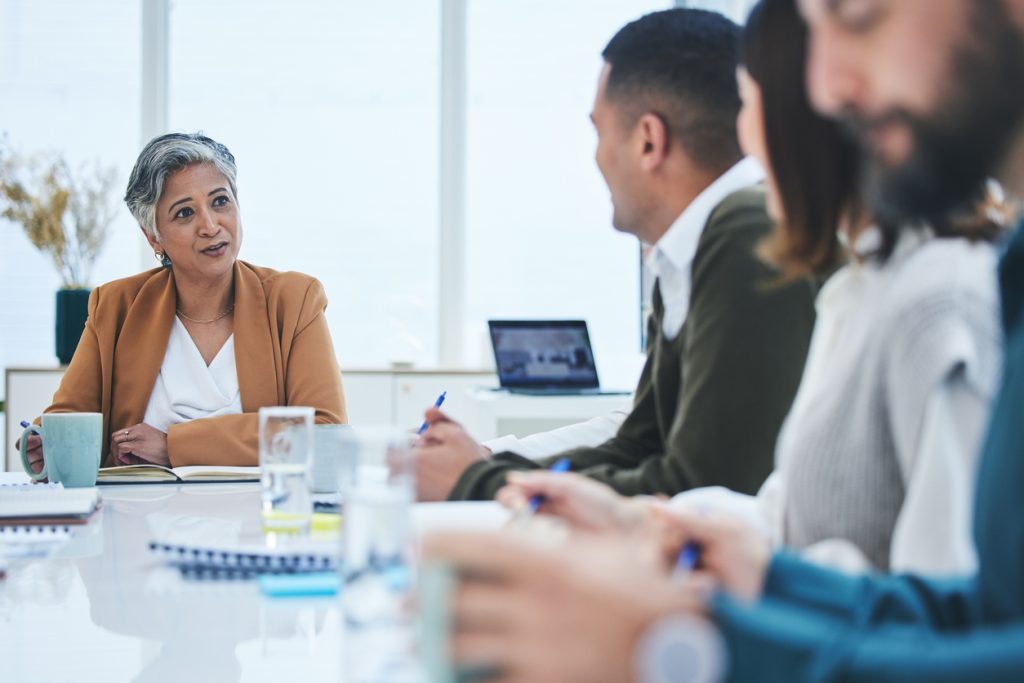 People sitting around office table during meeting
