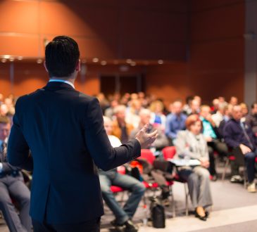 People attend presentation at conference
