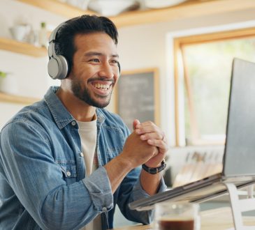 Man smiling during video call at home