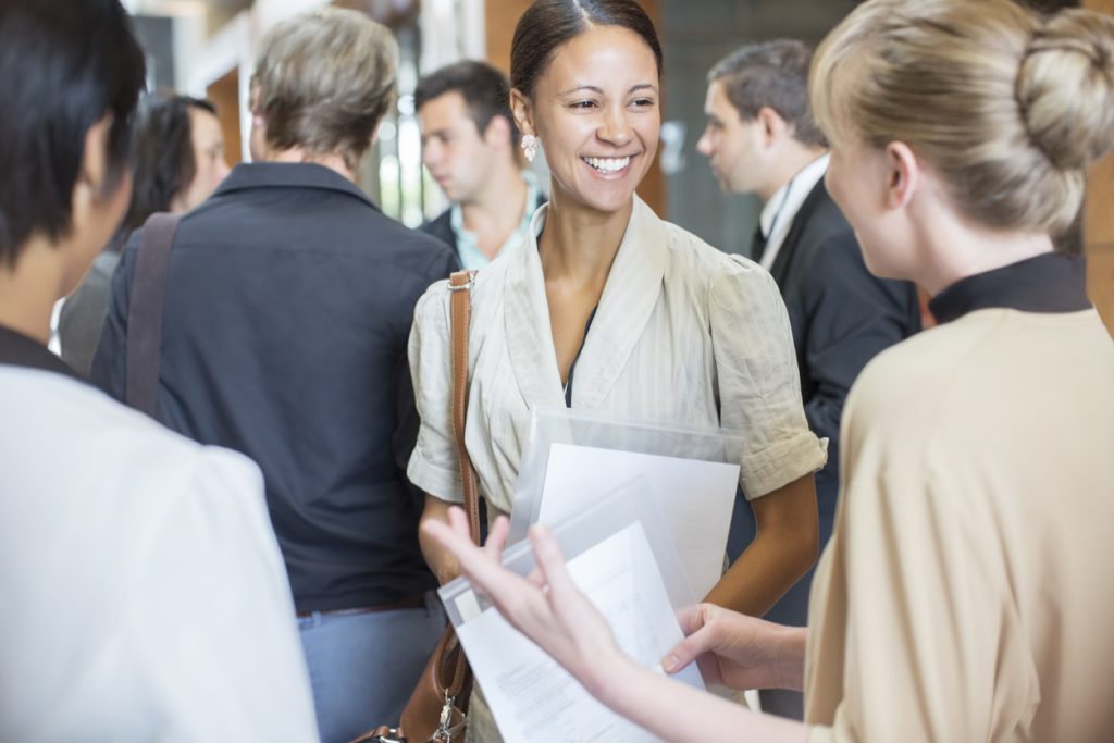 People chatting at networking event