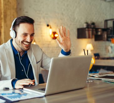 Man have business meeting via video call in home office