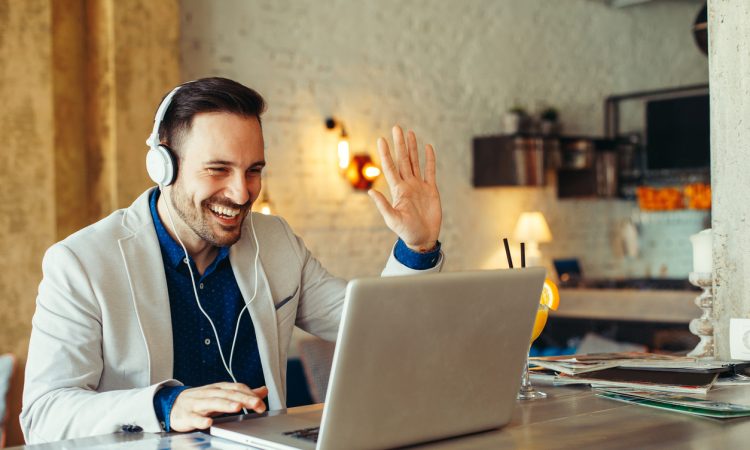 Man have business meeting via video call in home office