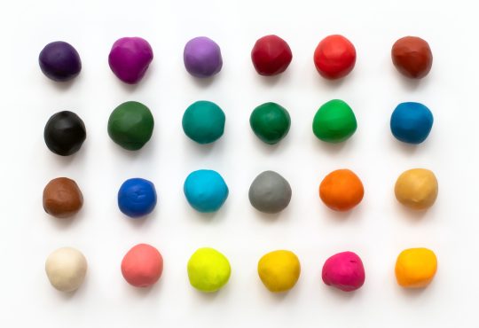 Colourful clay balls lined up in a grid