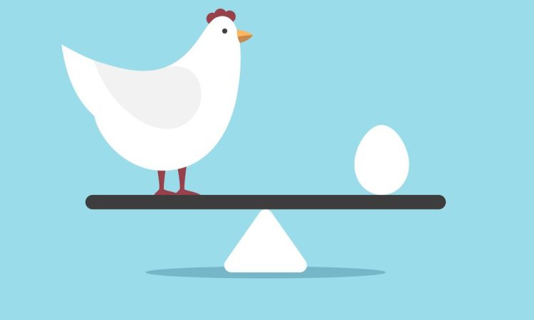 Chicken and egg on weight scale.