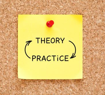 Sticky note pinned to a cork board with 'theory' and 'practice' written with arrows between them.