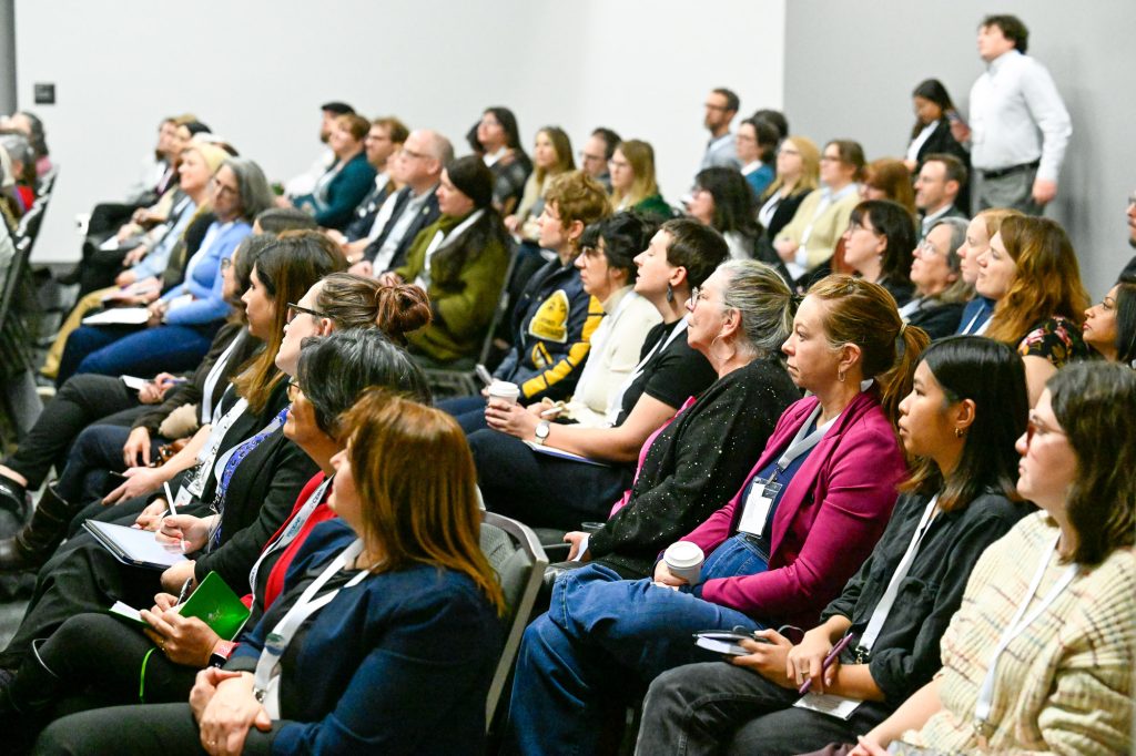 A packed room of people attends a session at CERIC's Cannexus conference.