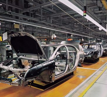 car production line with unfinished cars in a row