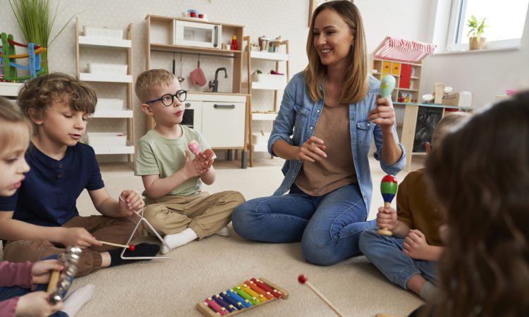 Young children with teacher in classroom