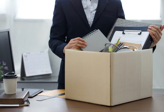 Person packing personal belongings up at work