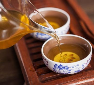 Cropped shot of pouring tea in traditional chinese teaware.