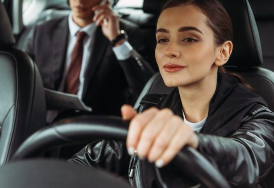 Taxi driver with passenger in back